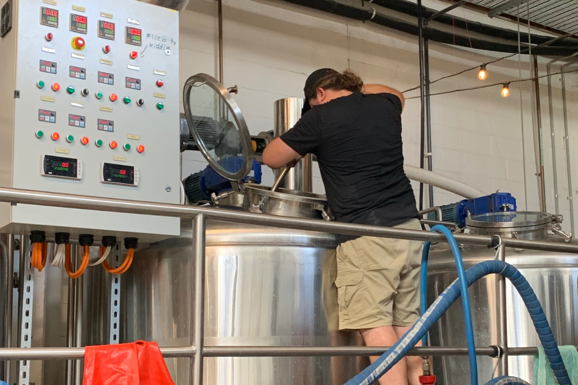 Johann brewing Boxer's first beer. The first beers are being made at Sea Legs until Boxer's brewhouse arrives.