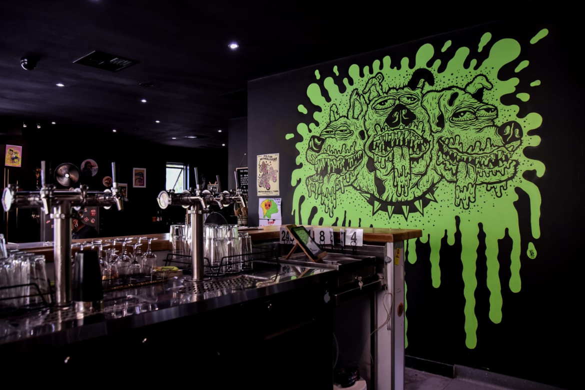 Freak Street's painting of Cerberus stands guard over the beer taps at Mongrel.